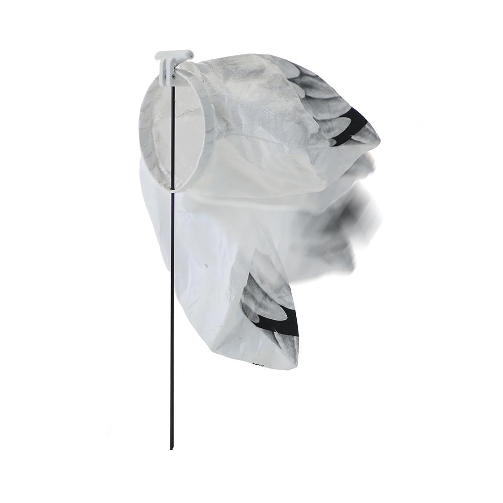 Bird-shaped fabric windsock on mounting pole