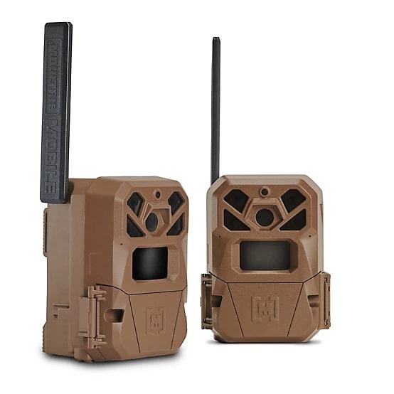 Two brown trail cameras with antennas