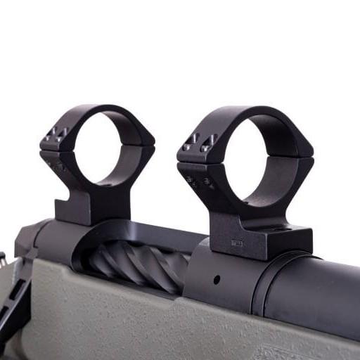 Close-up of rifle scope rings mounted on receiver