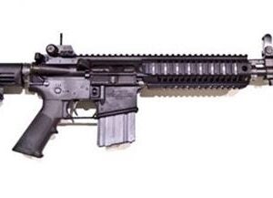 Black AR-15 style rifle on white background
