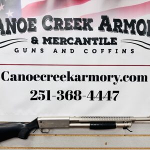 Shotgun displayed beneath Canoe Creek Armory sign