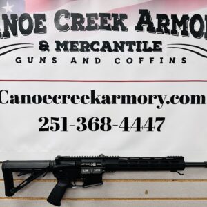 Rifle displayed beneath Canoe Creek Armory sign