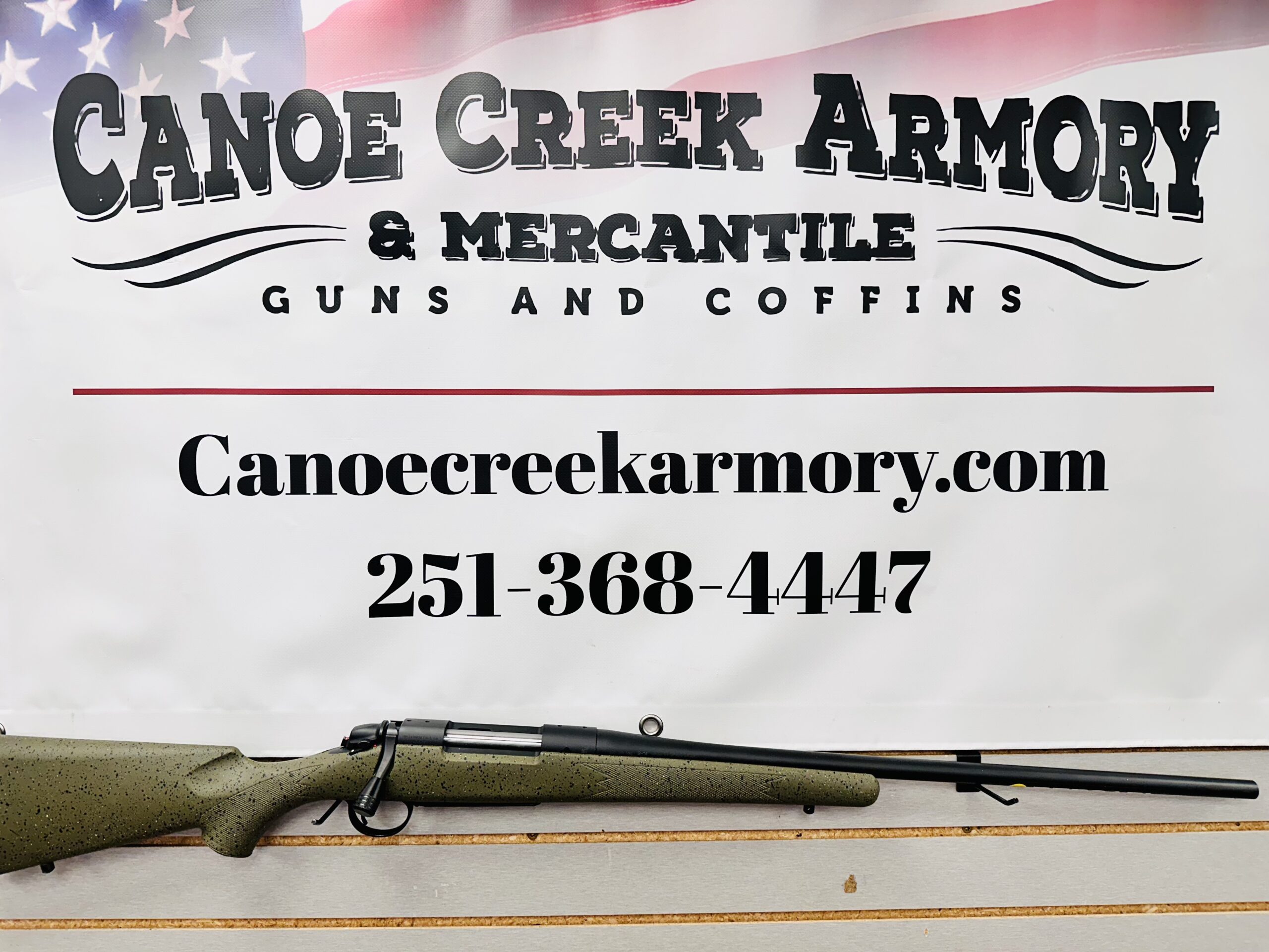 Canoe Creek Armory banner with rifle display