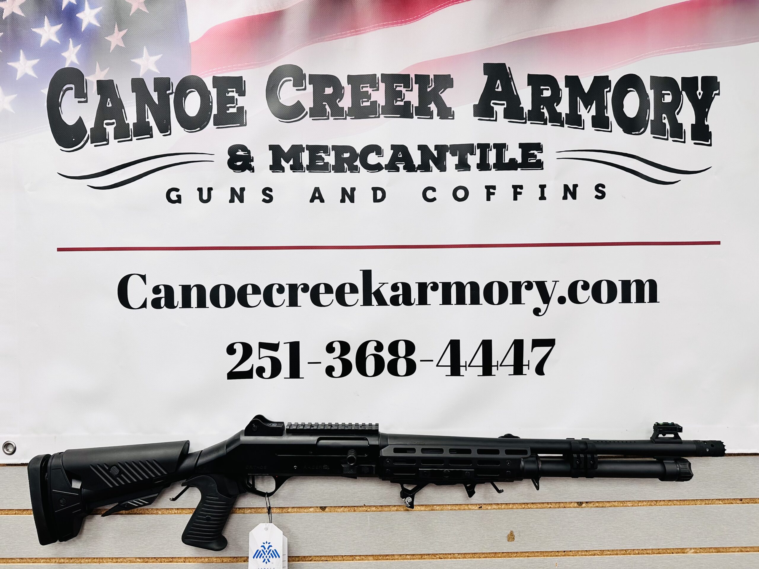 Canoe Creek Armory sign with shotgun display