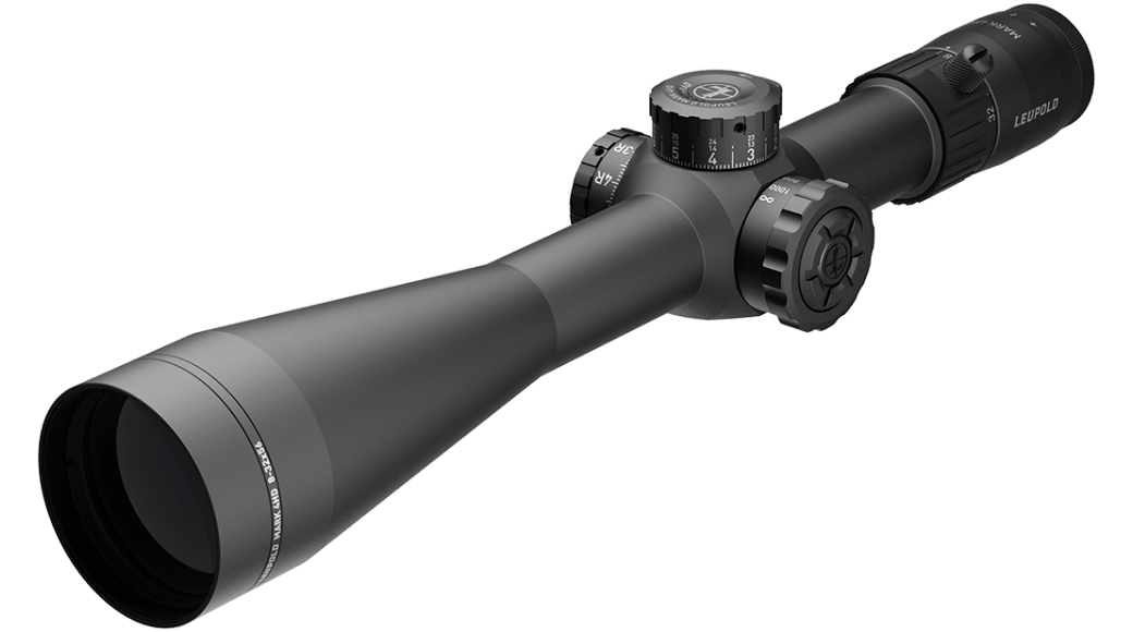 Black riflescope with adjustment turrets on white background