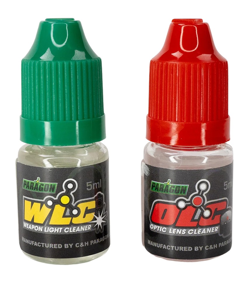 Two small cleaner bottles with green and red caps
