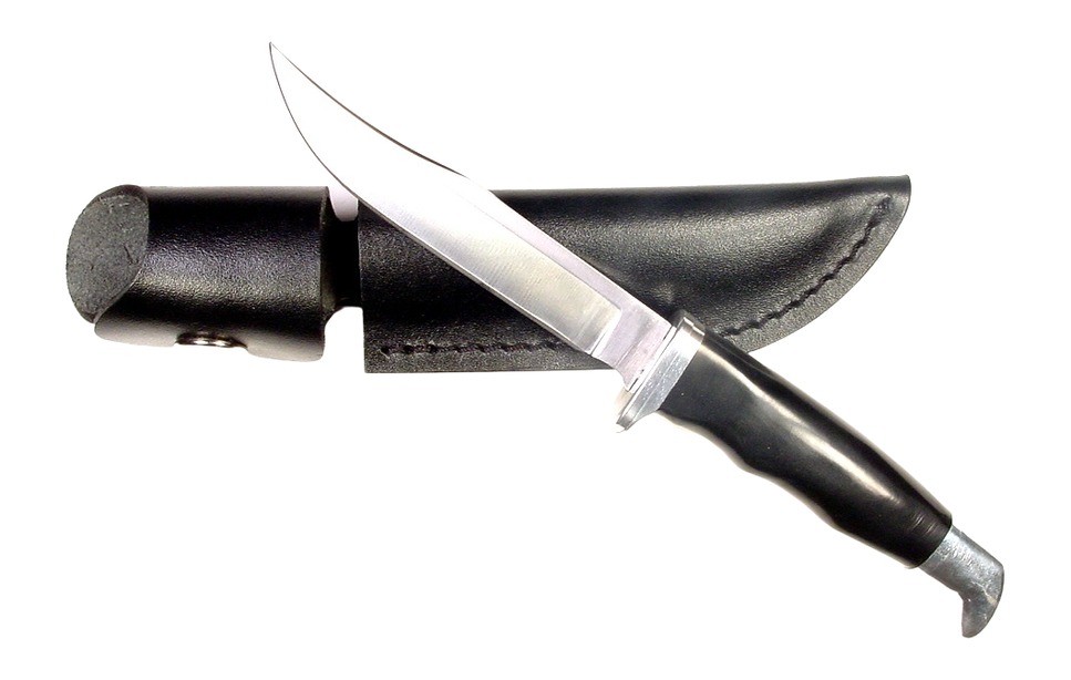 Fixed-blade knife with black handle and sheath