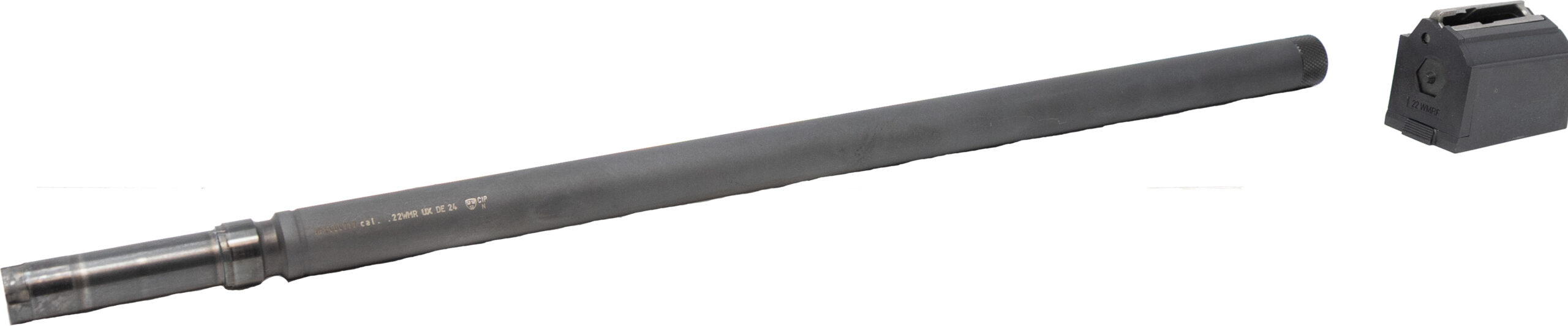 Rifle barrel and detachable magazine on white background