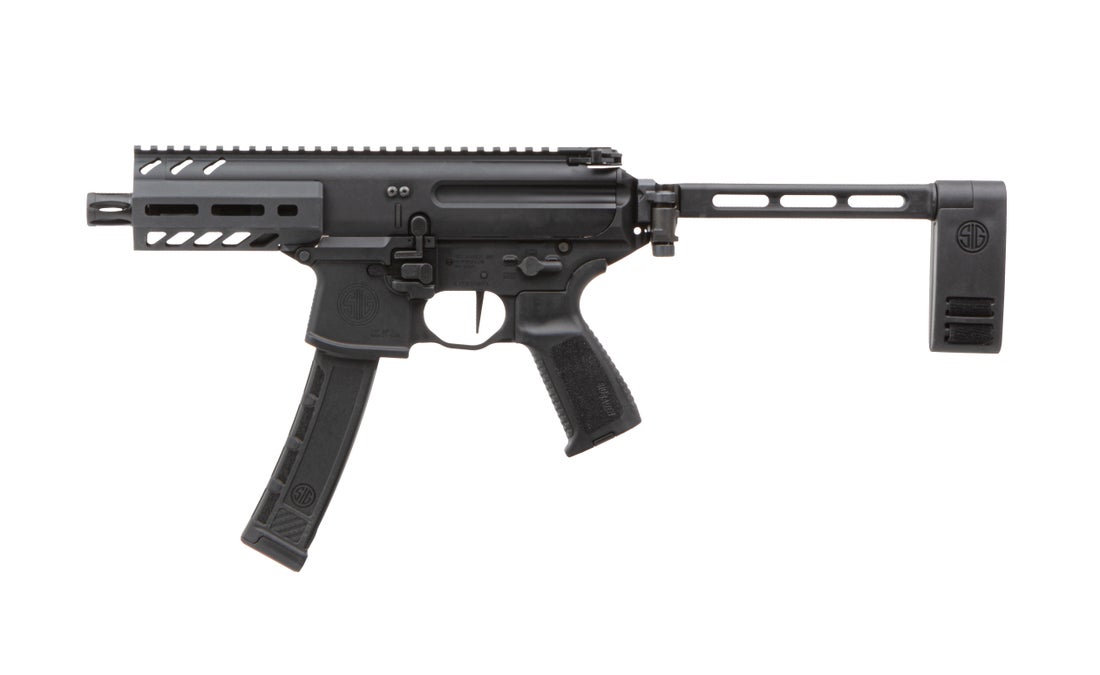 Black compact semi-automatic firearm with folding stock