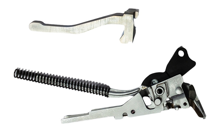 Disassembled metal firearm trigger components with spring
