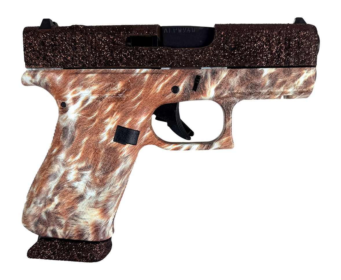 Compact pistol with brown camo grip and dark slide
