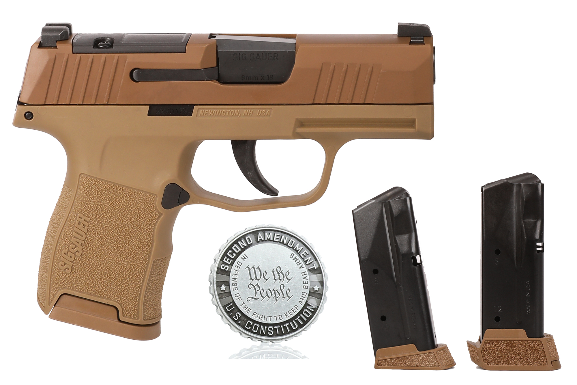 Tan SIG Sauer pistol with two magazines and coin