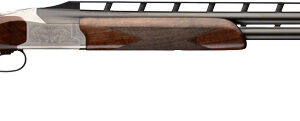 Side view of engraved over-under shotgun with wooden stock