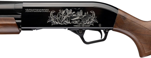 Winchester shotgun receiver with engraved wildlife scene
