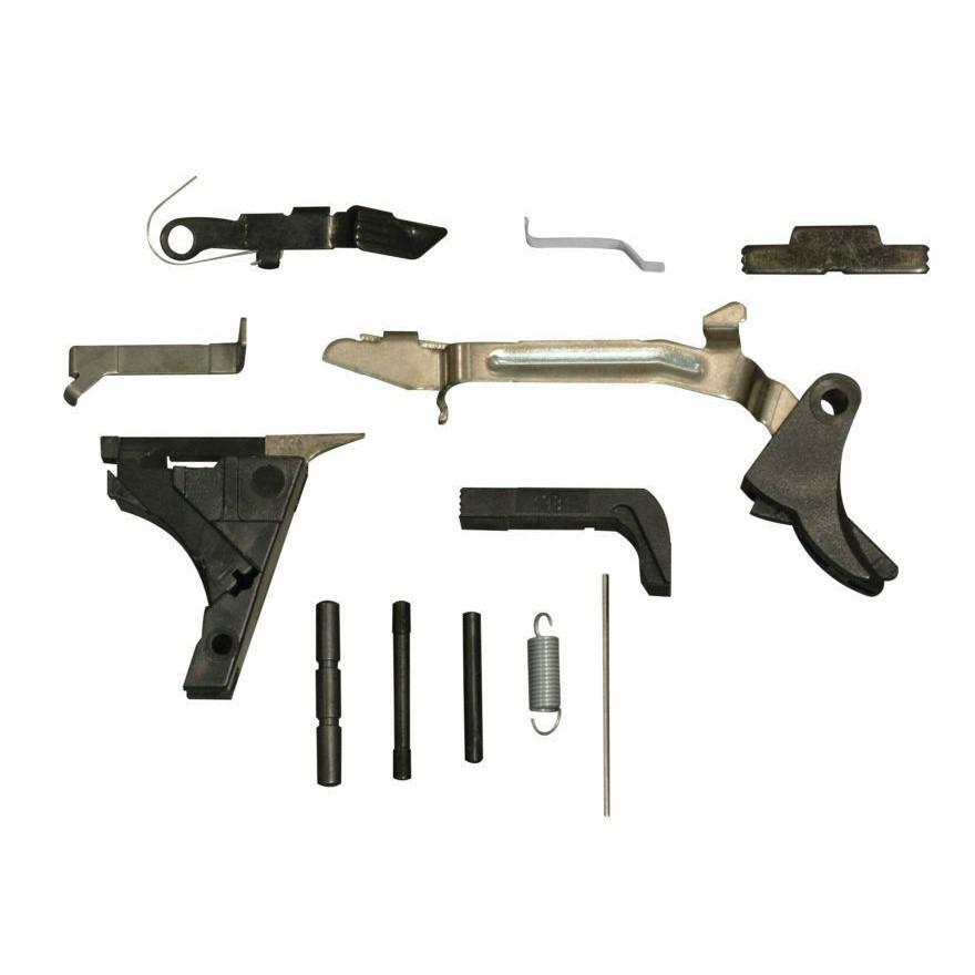 Assorted firearm trigger mechanism components on white background