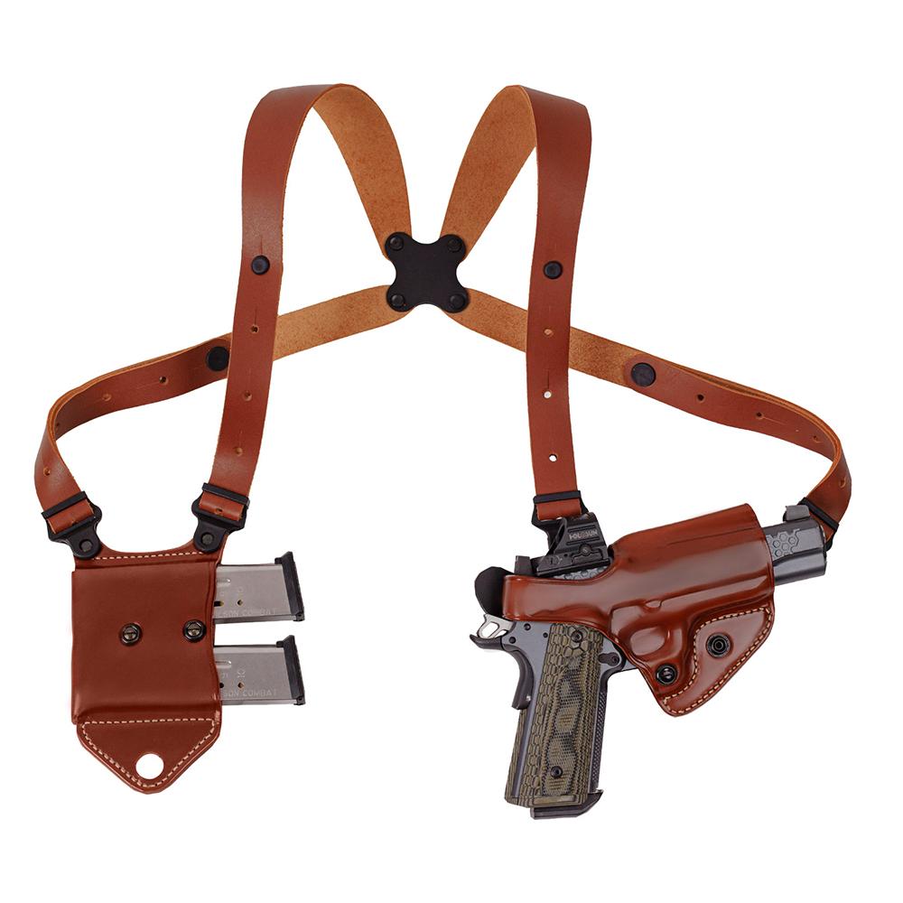 Brown leather shoulder holster with handgun and magazines