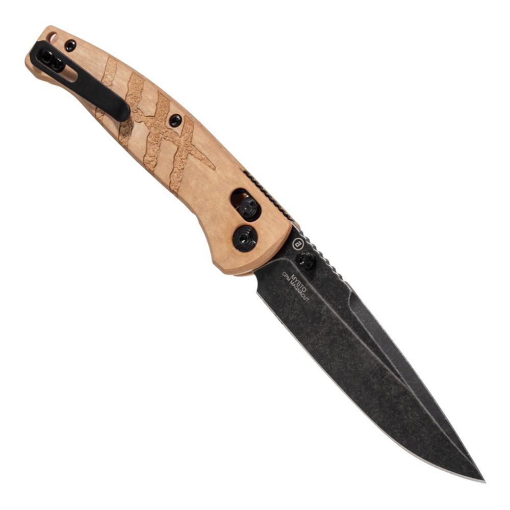 Open folding knife with engraved tan handle and black blade
