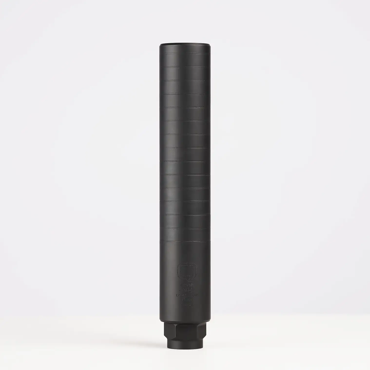 Black cylindrical firearm suppressor on white background