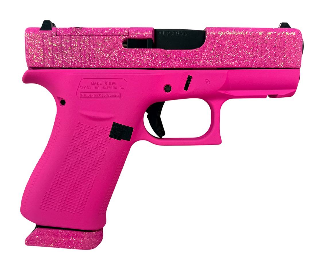 Bright pink Glock-style handgun with glittery slide
