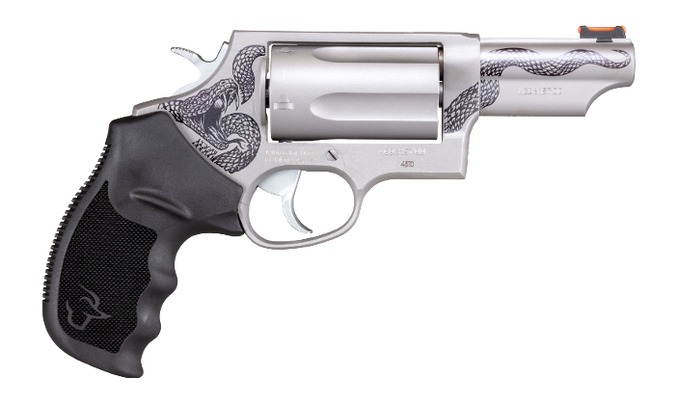Silver revolver with engraved snake design and black grip