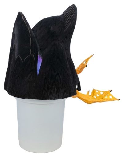 Black textured decorative figure on a white cup
