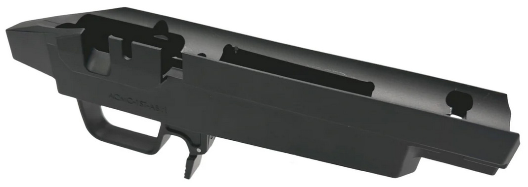 Black firearm receiver housing with trigger guard