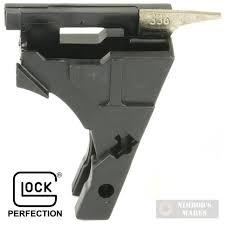 Black firearm magazine loader with brass cartridge