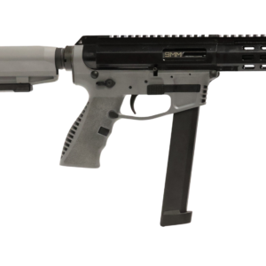 Compact black and gray firearm with extended magazine